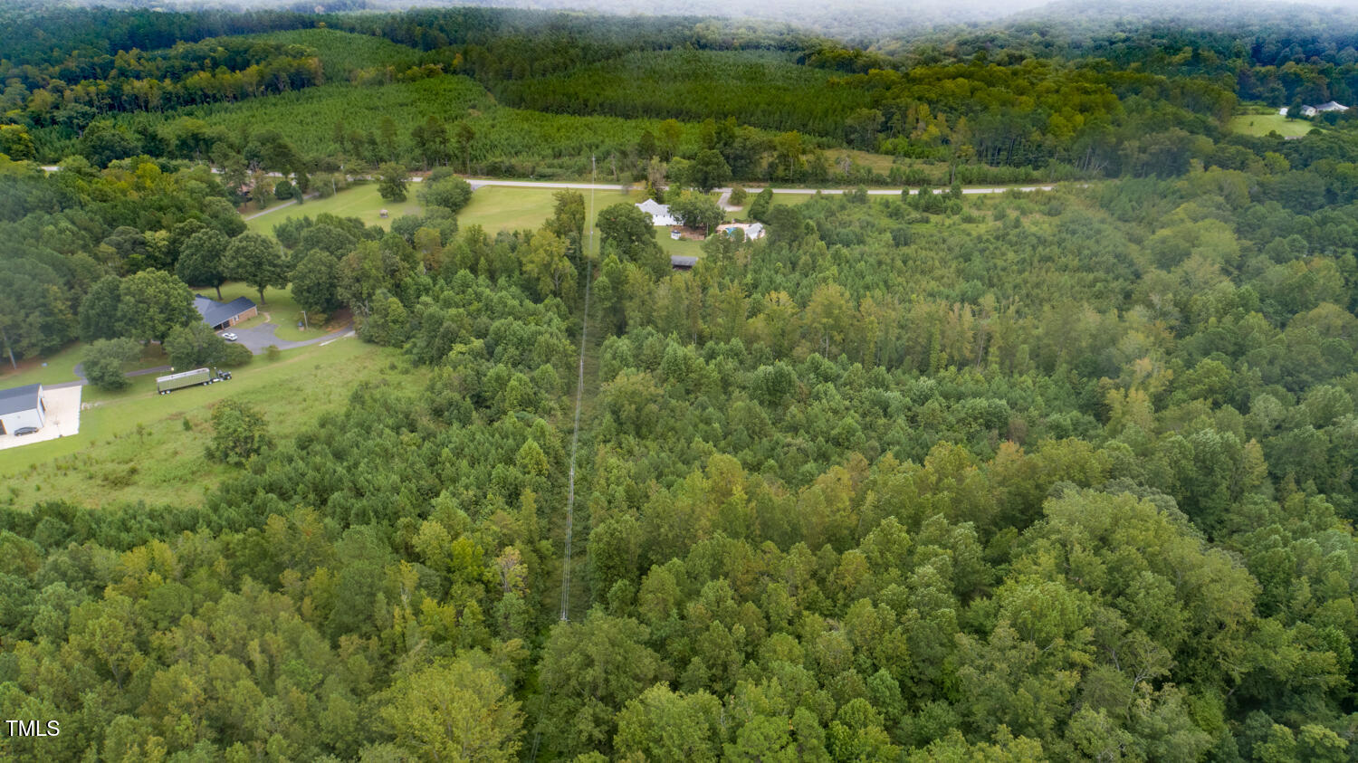 9841 Quail Roost Road Bahama, NC 27503 - Photo 10 of 12 an aerial view of residential houses with outdoor space and trees