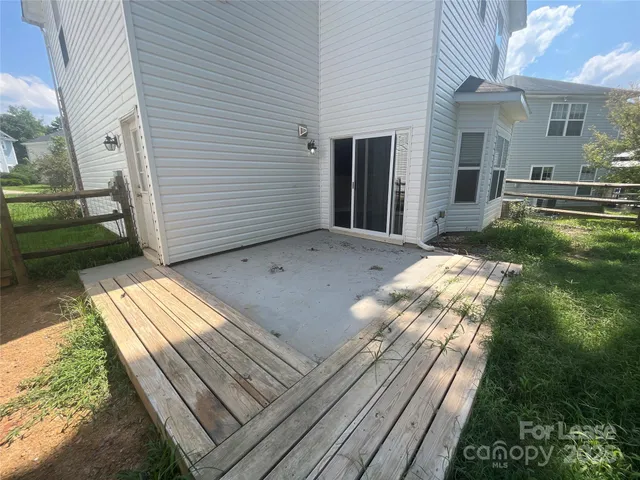 a view of backyard with seating space