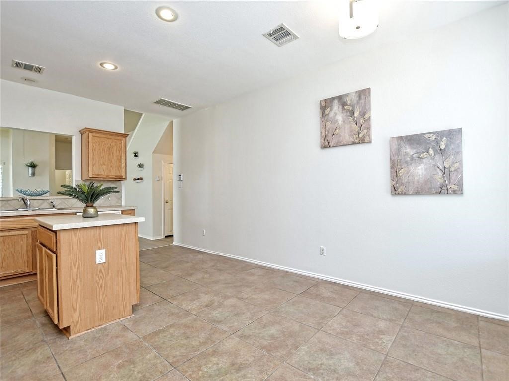 1117 Rawhide Trail Cedar Park, TX 78613 - Photo 15 of 36 a room with window and a kitchen