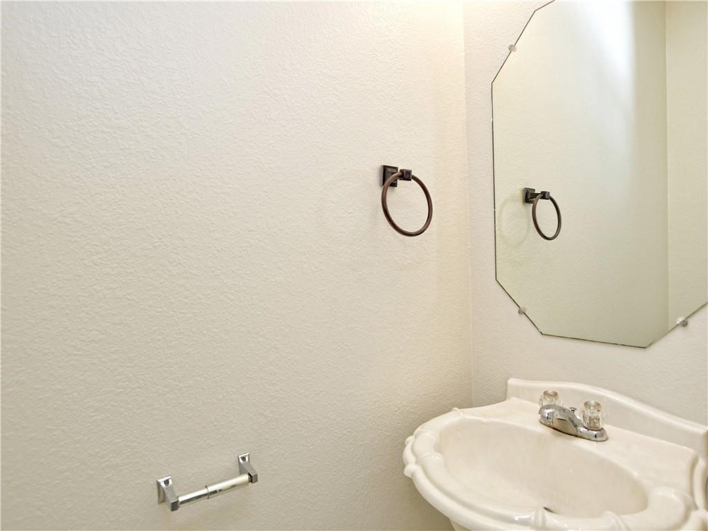 1117 Rawhide Trail Cedar Park, TX 78613 - Photo 25 of 36 a bathroom with a sink and mirror