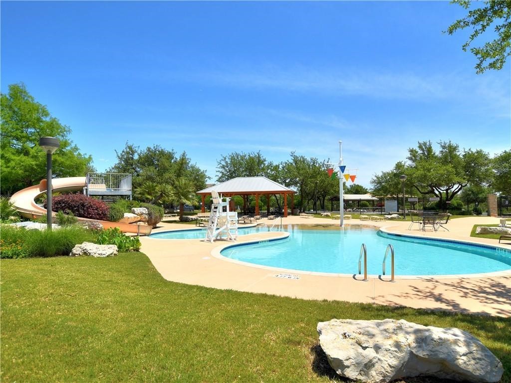 1117 Rawhide Trail Cedar Park, TX 78613 - Photo 34 of 36 a view of a swimming pool with lounge chair