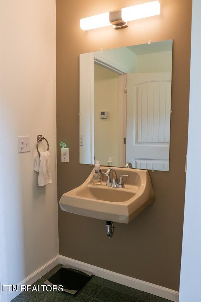 1518 Cummingsville And Sparkman Road Doyle, TN 38559 - Photo 22 of 58 a bathroom with a sink a mirror and a toilet