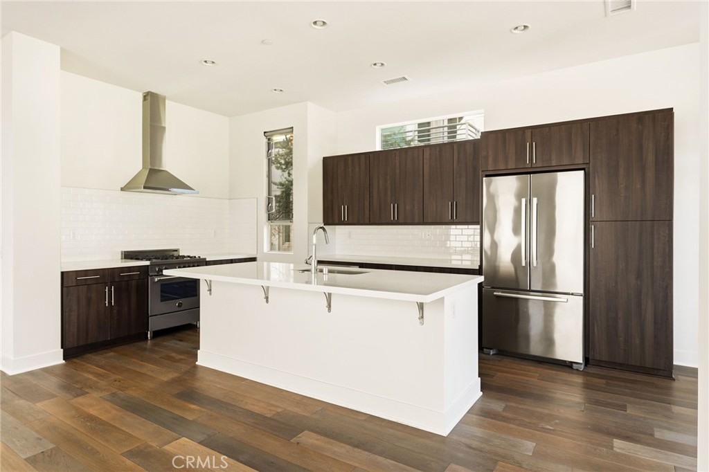 2201 Tom Mix Road Silver Lake, CA 90026 - Photo 6 of 25 a kitchen with stainless steel appliances a refrigerator and a stove