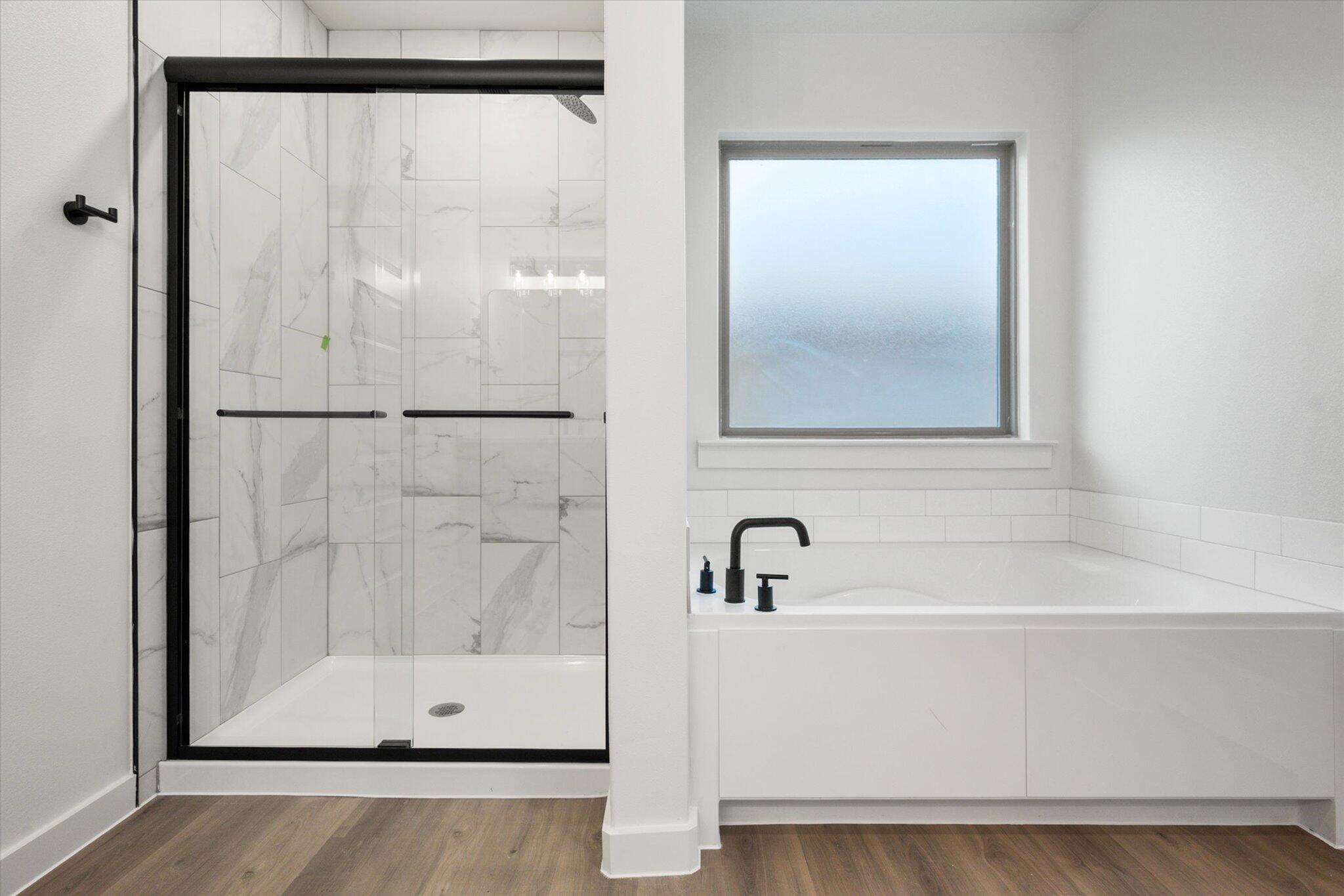 7006 56th Street Lubbock, TX 79407 - Photo 15 of 22 a bathroom with a glass shower door