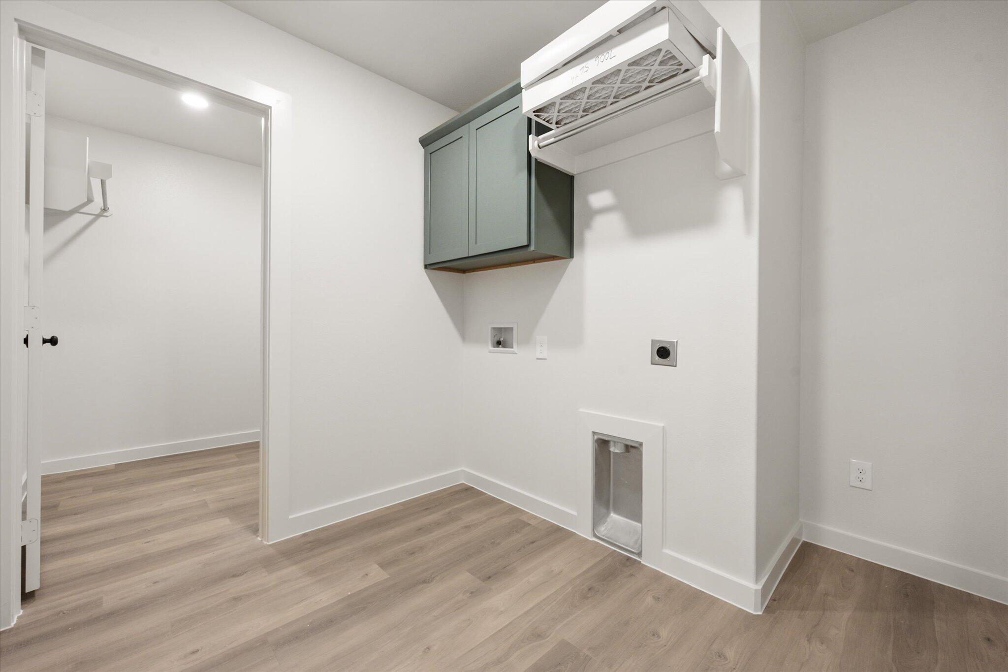 7006 56th Street Lubbock, TX 79407 - Photo 20 of 22 an empty room with wooden floor and mirror