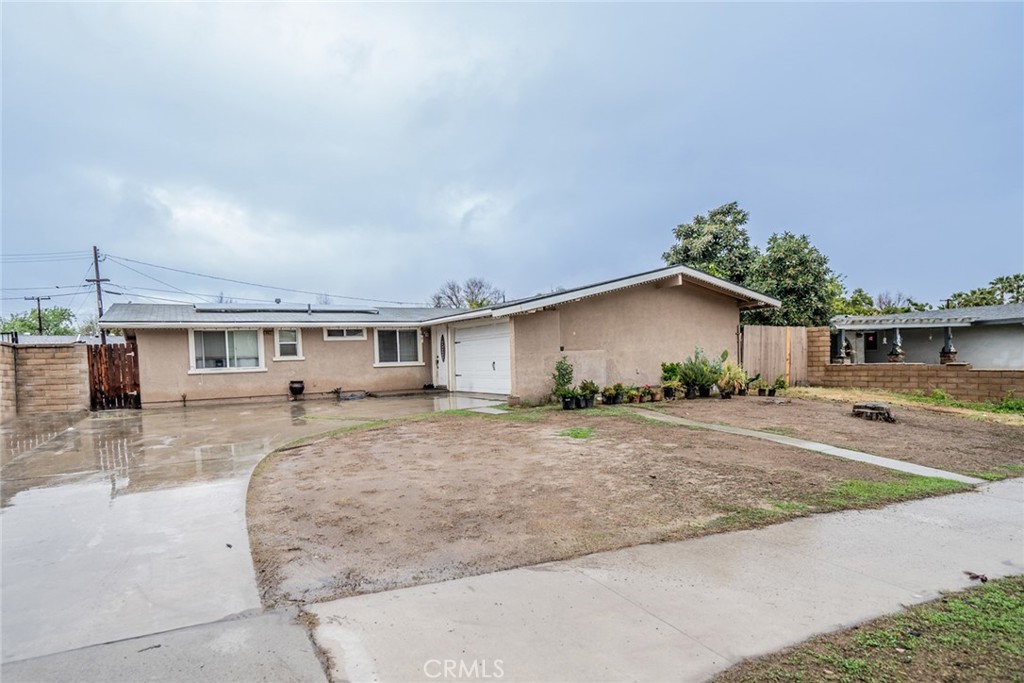 8853 Shawnee Avenue Riverside, CA 92503 - Photo 1 of 1 a front view of a house with yard
