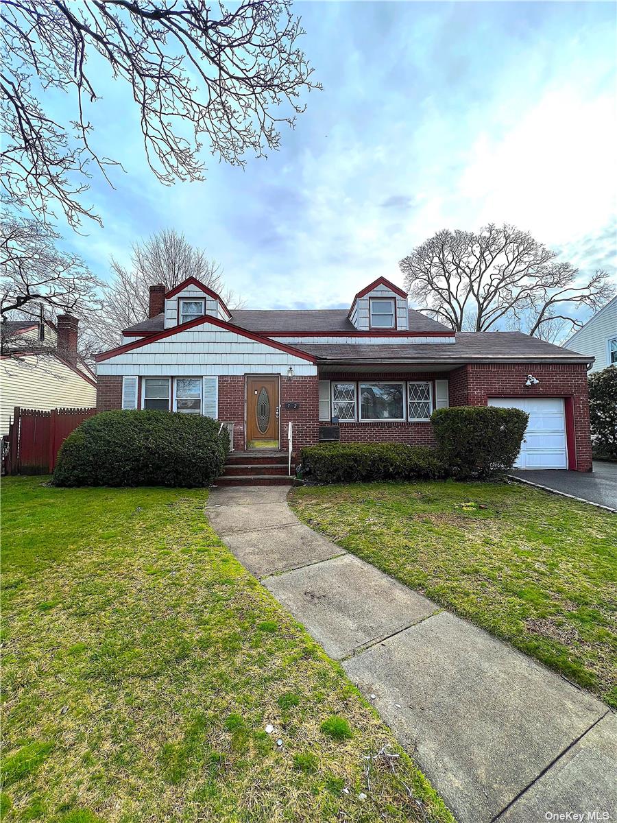 72 Duncan Road Hempstead, NY 11550 - Photo 1 of 1 a front view of a house with a garden