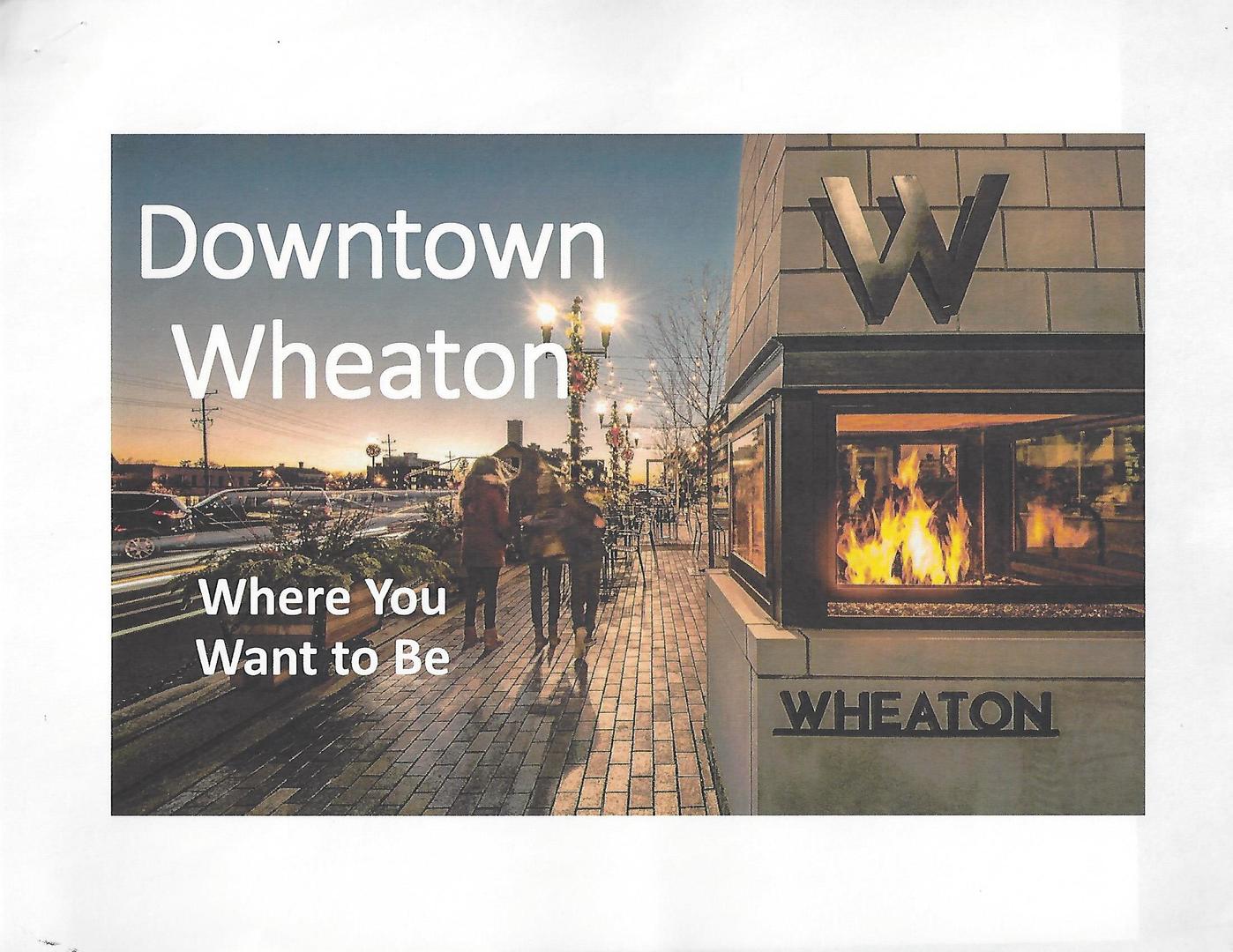 116 North Main Street, Unit 3 Wheaton, IL 60187 - Photo 12 of 12 a black and white photo of a book and a table