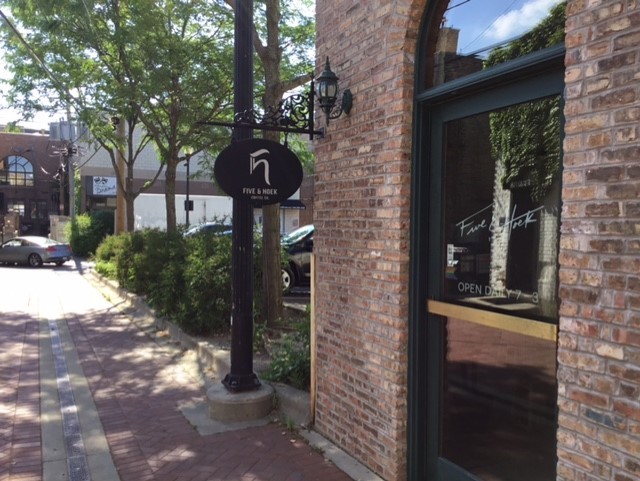 116 North Main Street, Unit 3 Wheaton, IL 60187 - Photo 10 of 12 a street sign on a brick wall