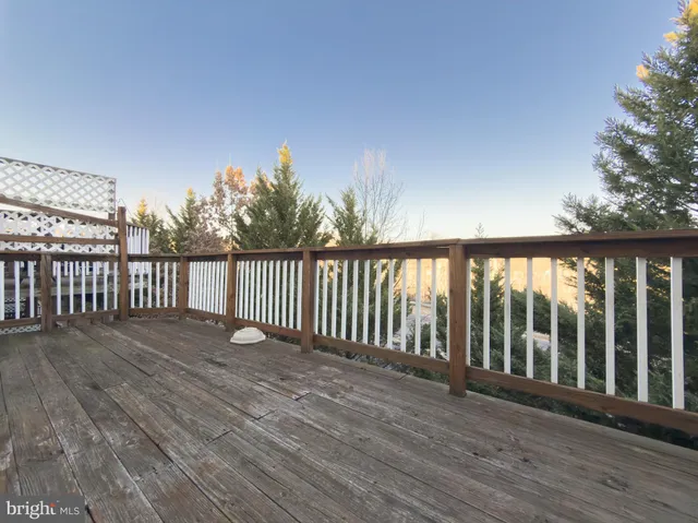 a view of a balcony with wooden floor