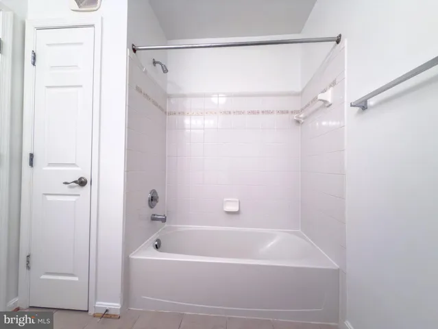 a bathroom with a shower and a bath tub