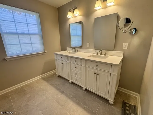 a white bath tub sitting next to a white toilet