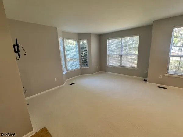 a kitchen with stainless steel appliances kitchen island granite countertop a stove a sink and a microwave