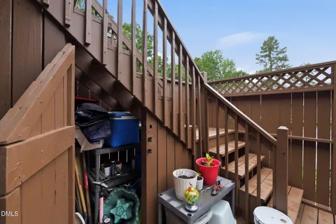 an aerial view of a house with roof deck couches fire pit and outdoor seating