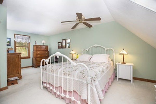 40 Allen Place, Unit 40 Scituate, MA 02066 - Photo 11 of 23 a bedroom with two beds and a chandelier