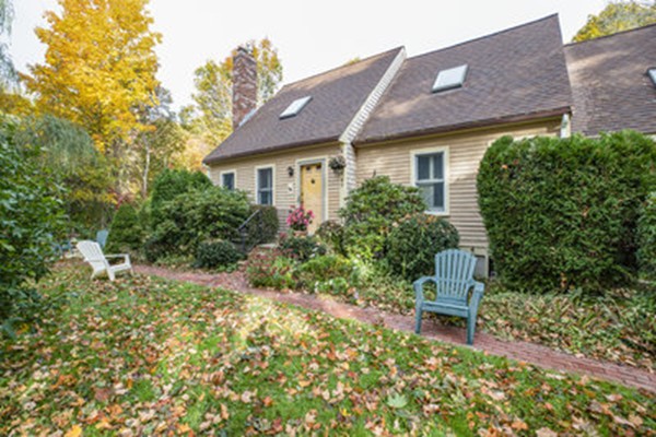 40 Allen Place, Unit 40 Scituate, MA 02066 - Photo 16 of 23 a brick house with wooden bench and some plants