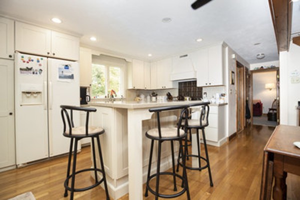40 Allen Place, Unit 40 Scituate, MA 02066 - Photo 9 of 23 a kitchen with stainless steel appliances kitchen island granite countertop a refrigerator and microwave
