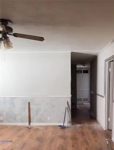 a kitchen with granite countertop a stove and white cabinets