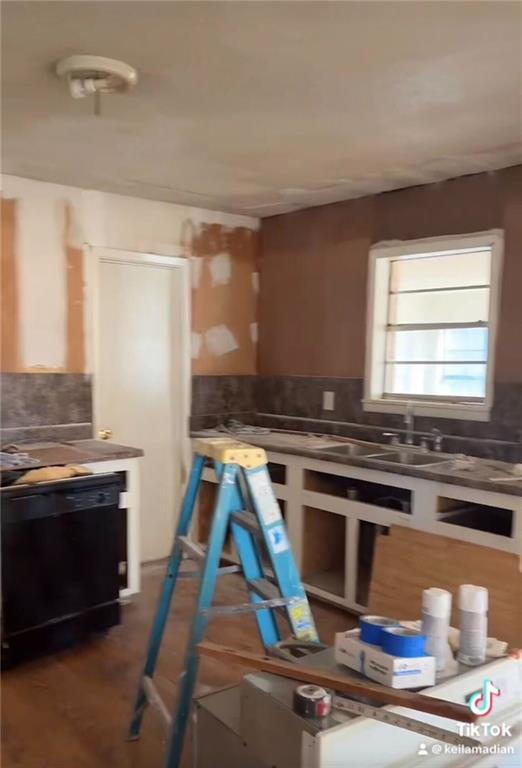 106 Melody Lane Northwest Rome, GA 30165 - Photo 6 of 21 a kitchen with granite countertop a stove and white cabinets