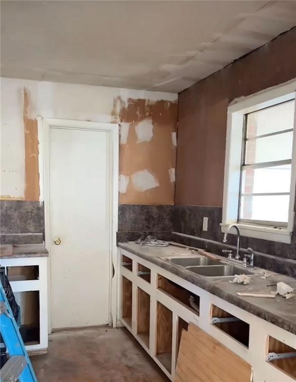 106 Melody Lane Northwest Rome, GA 30165 - Photo 8 of 21 a kitchen with stainless steel appliances granite countertop a sink stove and refrigerator