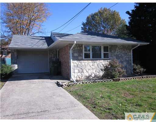 17 Gurley Road Edison, NJ 08817 - Photo 1 of 8 a front view of a house with a garden