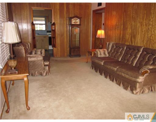 17 Gurley Road Edison, NJ 08817 - Photo 3 of 8 a view of a livingroom with furniture and closet