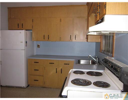 17 Gurley Road Edison, NJ 08817 - Photo 6 of 8 a kitchen with a sink and a stove