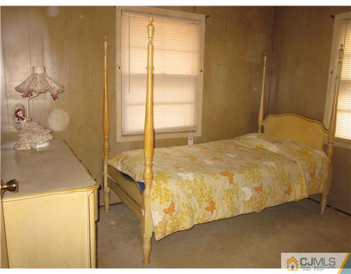 17 Gurley Road Edison, NJ 08817 - Photo 8 of 8 a large bed sitting in a bathroom next to a window