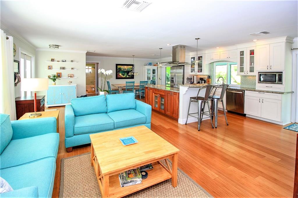 21 Ridgeview Road South Stuart, FL 34996 - Photo 7 of 22 a living room with furniture and kitchen view with wooden floor