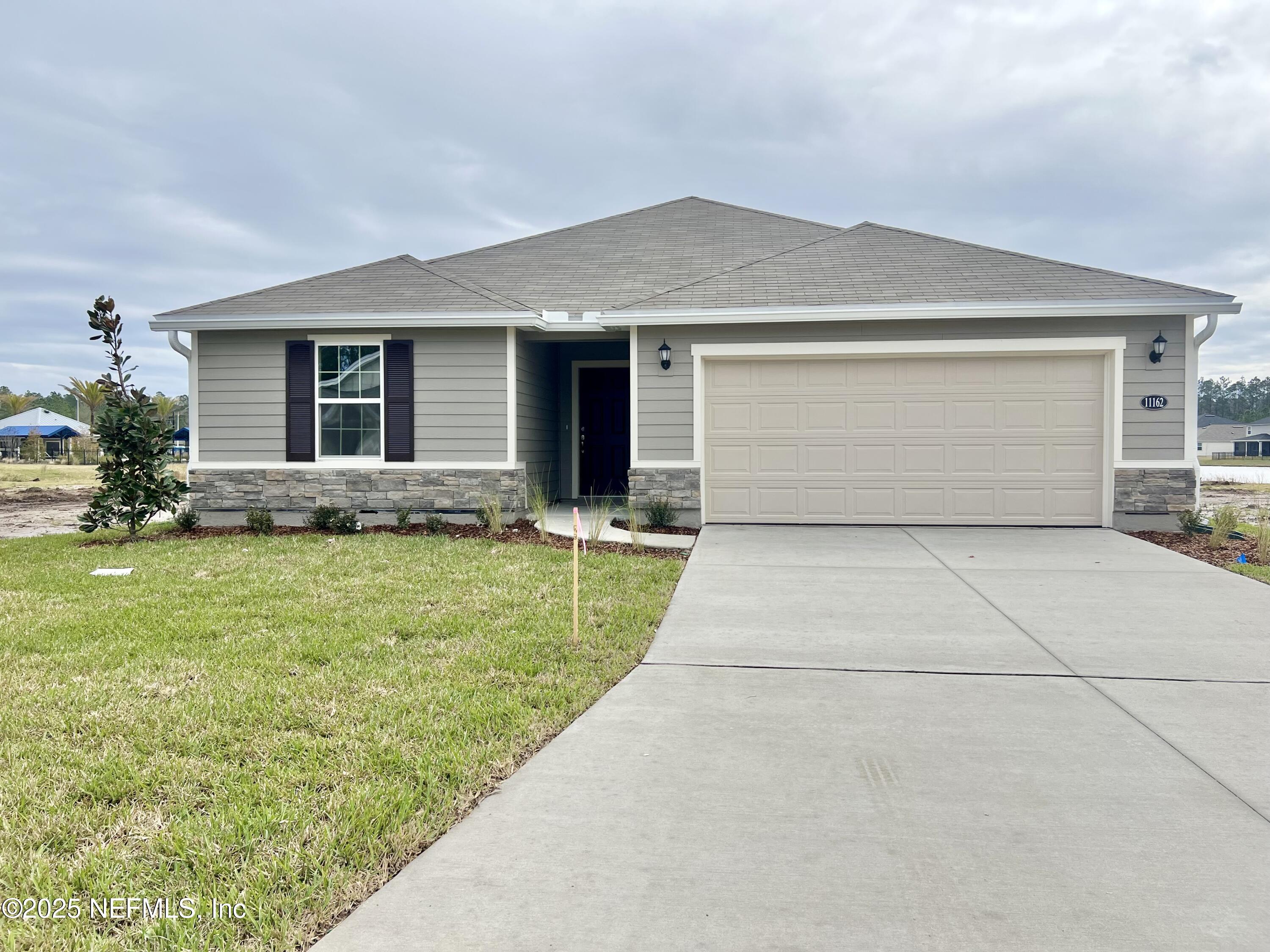 11162 Spring Meadows Road Jacksonville, FL 32222 - Photo 1 of 14 FRONT