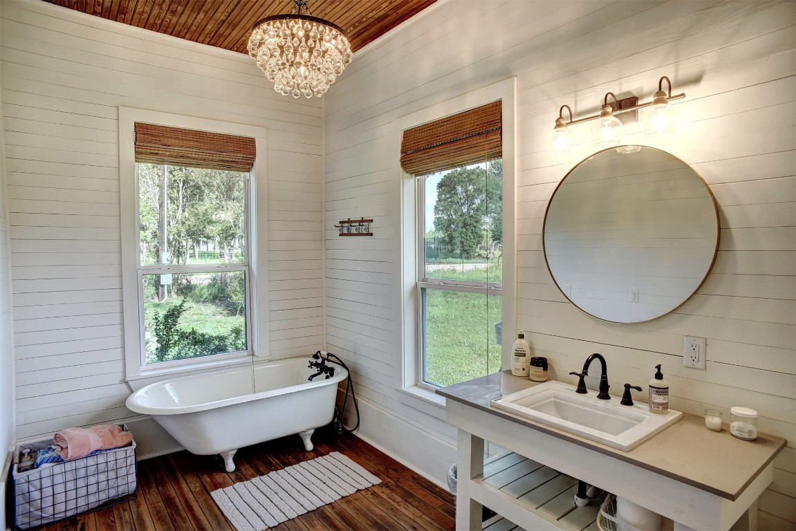 141 Grassyville Road Paige, TX 78659 - Photo 11 of 30 a bathroom with a sink and a mirror