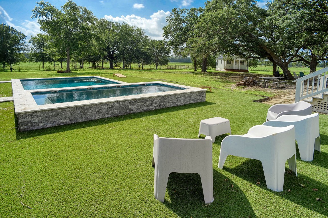 141 Grassyville Road Paige, TX 78659 - Photo 16 of 30 a view of a house with a big yard