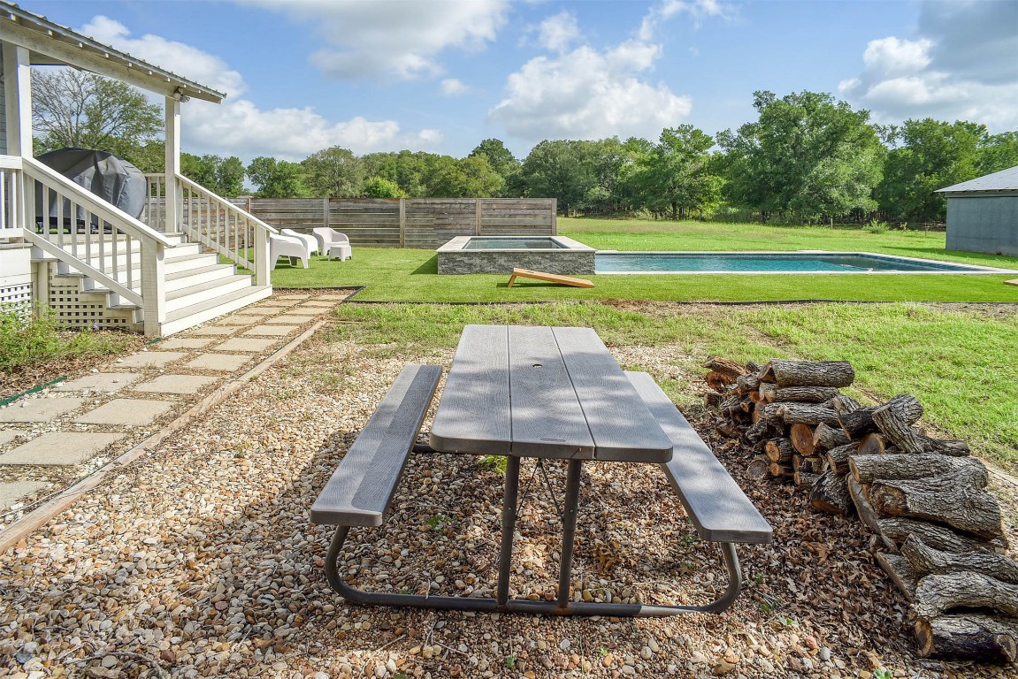 141 Grassyville Road Paige, TX 78659 - Photo 17 of 30 a view of a backyard with a garden