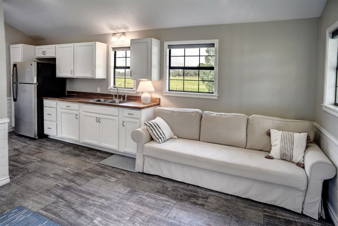 141 Grassyville Road Paige, TX 78659 - Photo 22 of 30 a living room with granite countertop furniture and fireplace