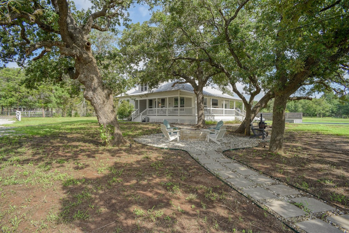 141 Grassyville Road Paige, TX 78659 - Photo 27 of 30 a front view of a house with a yard