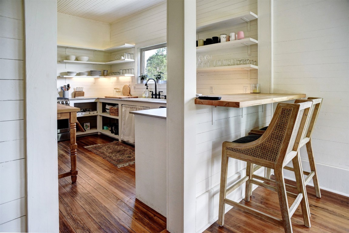 141 Grassyville Road Paige, TX 78659 - Photo 8 of 30 a view of a dining room with furniture window and wooden floor