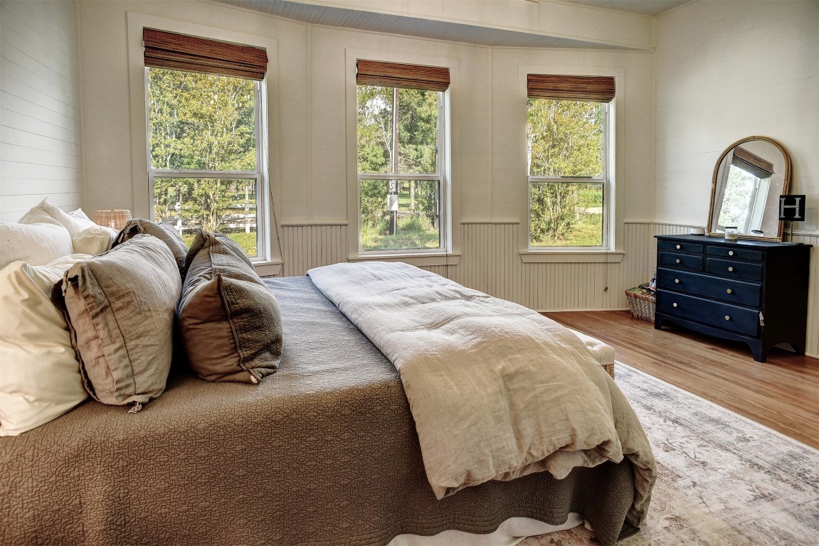 141 Grassyville Road Paige, TX 78659 - Photo 9 of 30 a bedroom with a bed and a dresser next to a window