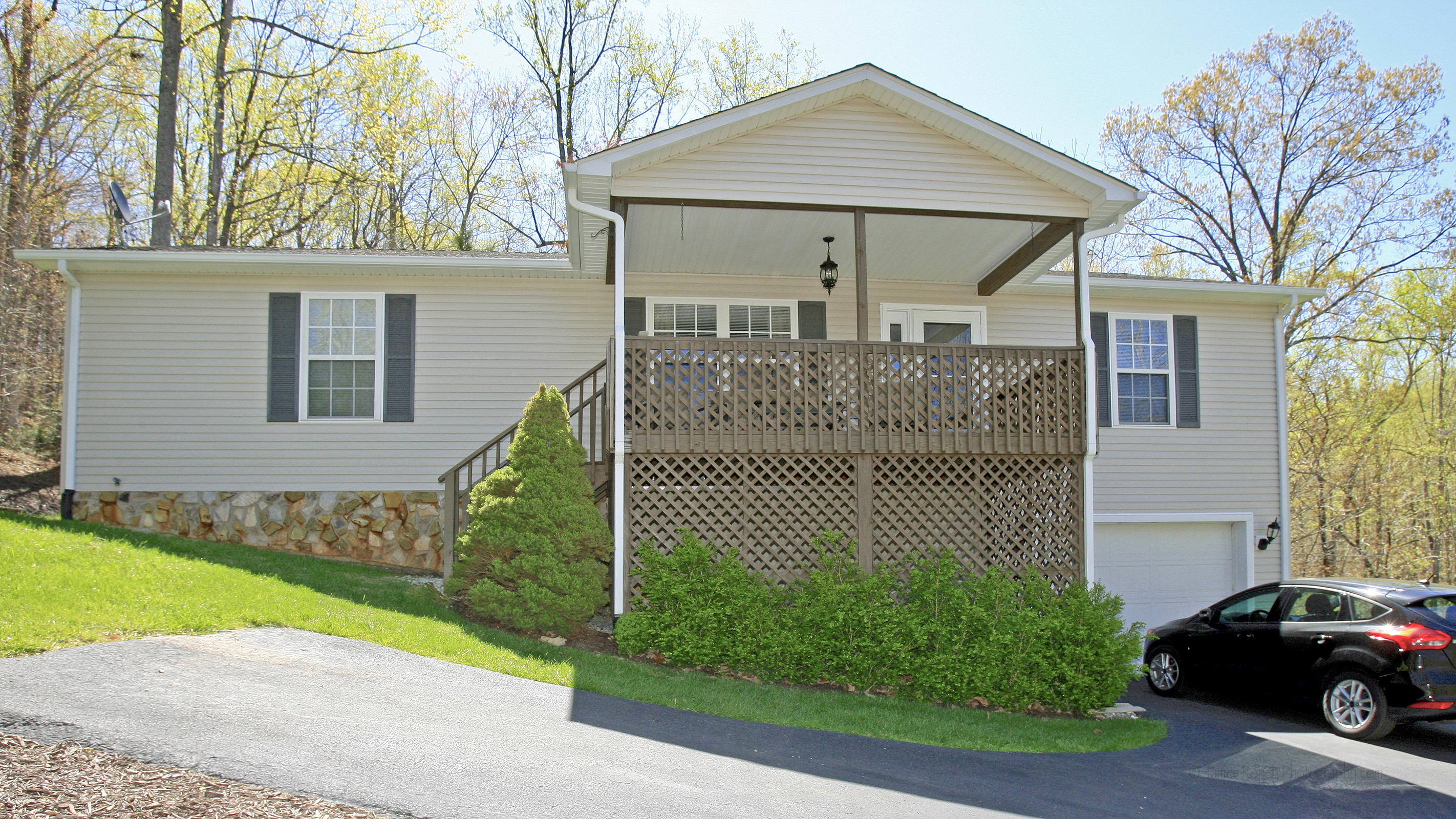 248 Silver Shadow Road Hardy, VA 24101 - Photo 3 of 50 a front view of a house with a garden