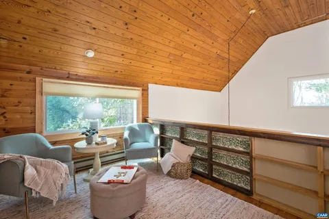 a bedroom with a bed and glass window