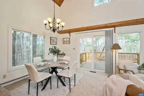 a view of a livingroom with furniture and a chandelier