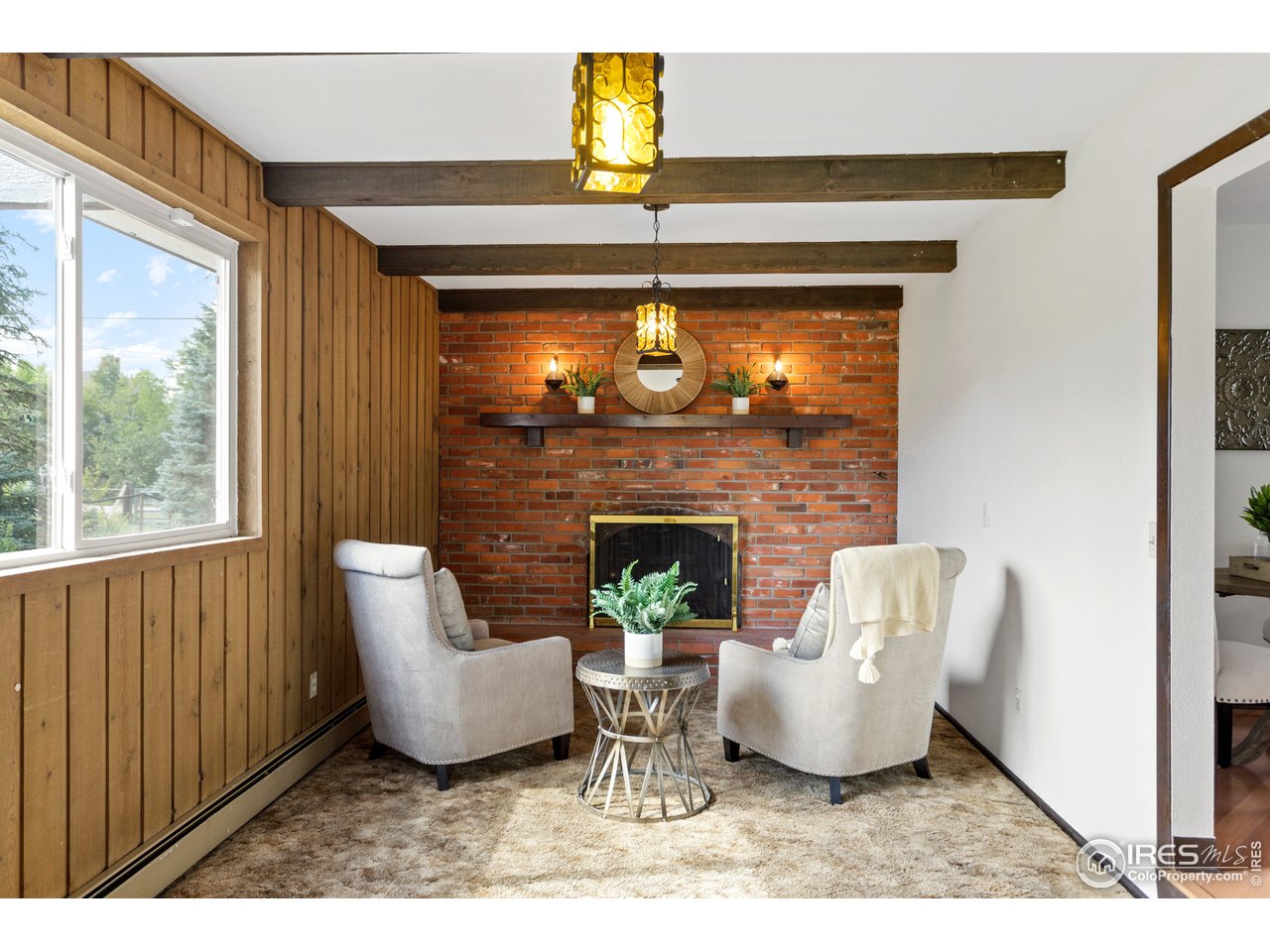 5758 Rustic Knolls Drive Boulder, CO 80301 - Photo 11 of 28 a living room with furniture and a fireplace