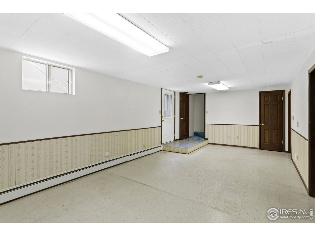 5758 Rustic Knolls Drive Boulder, CO 80301 - Photo 20 of 28 a view of an empty room with a window