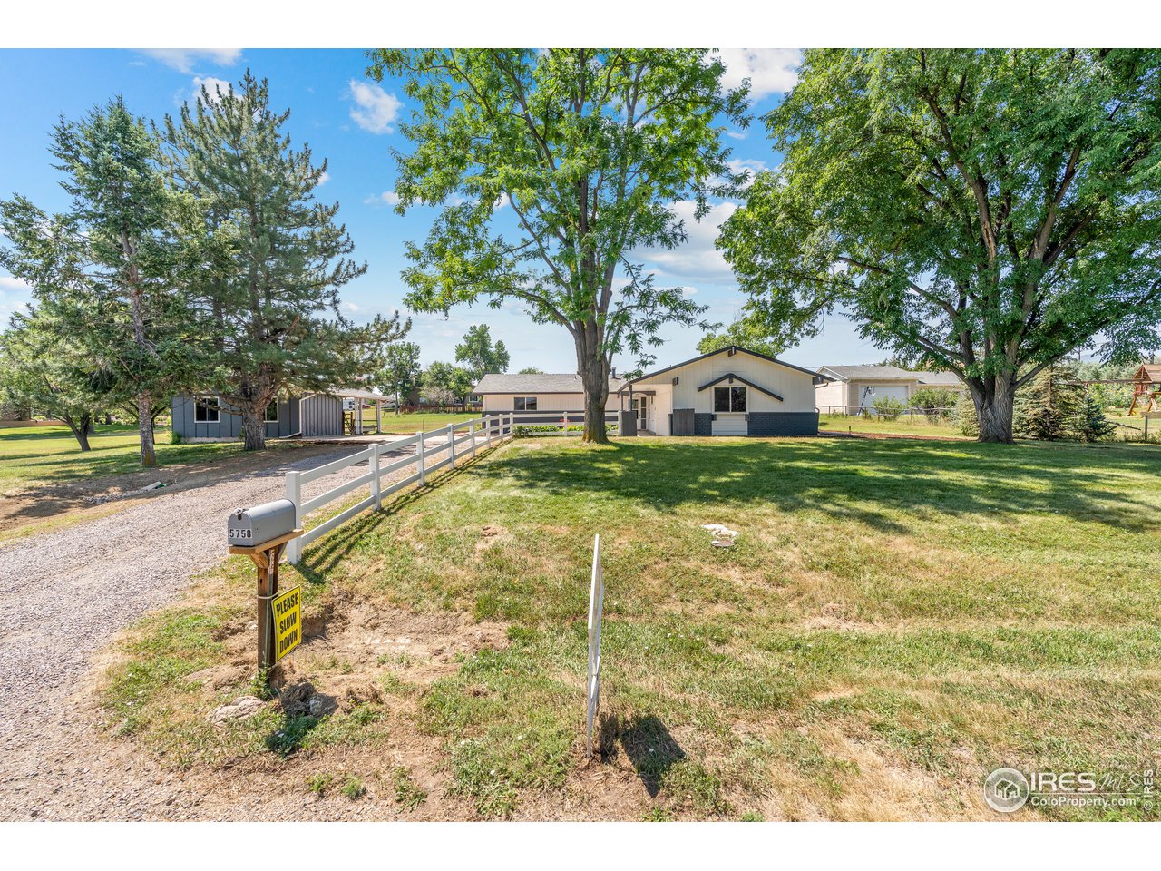 5758 Rustic Knolls Drive Boulder, CO 80301 - Photo 2 of 28 a view of a swimming pool with a yard and sitting area