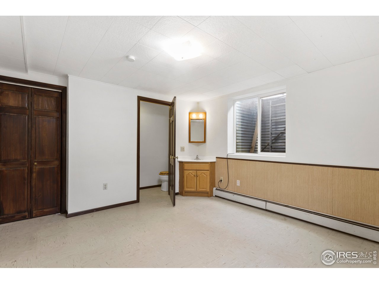 5758 Rustic Knolls Drive Boulder, CO 80301 - Photo 21 of 28 a view of an empty room with a window