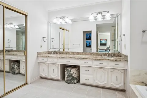 a bathroom with a sink double vanity and a mirror