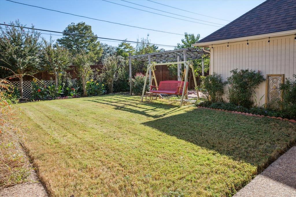 4302 Brooktree Lane Dallas, TX 75287 - Photo 4 of 23 a backyard of a house with seating space