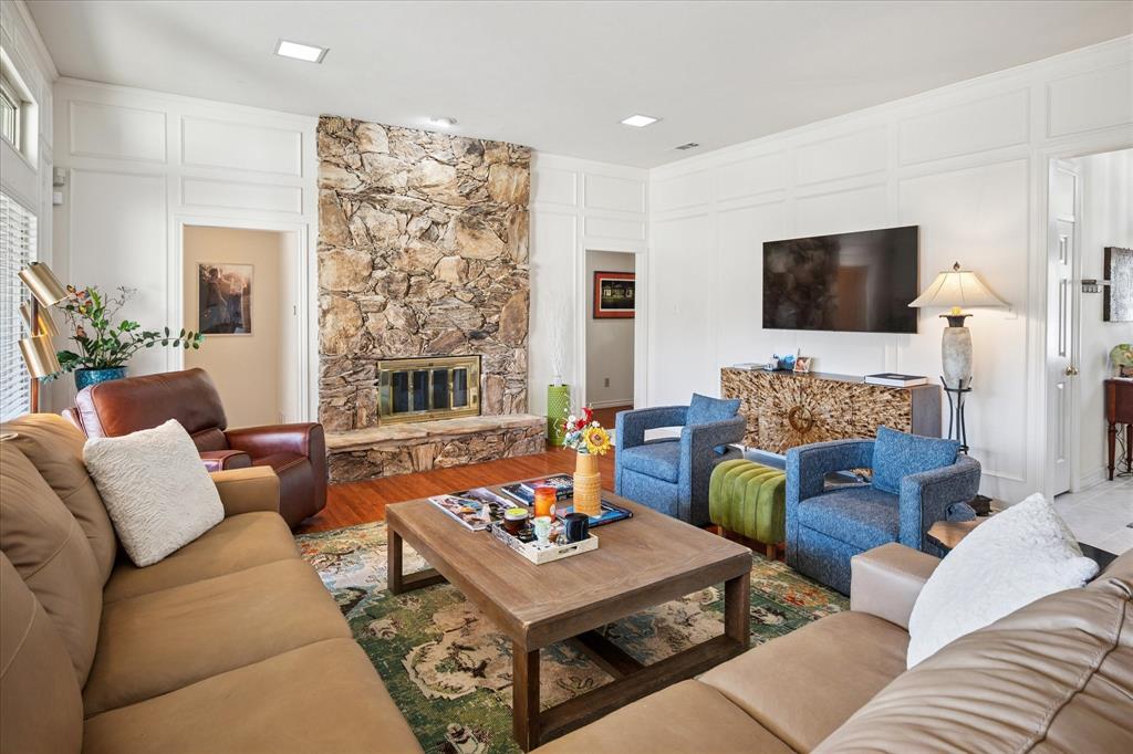 4302 Brooktree Lane Dallas, TX 75287 - Photo 7 of 23 a living room with furniture and a flat screen tv