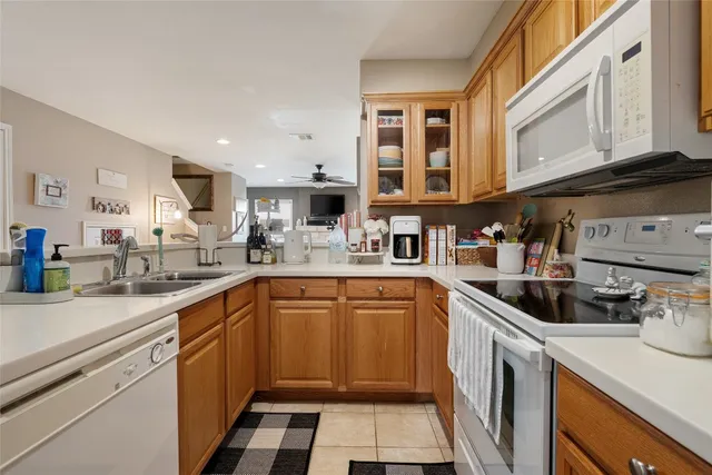 a kitchen with stainless steel appliances granite countertop a sink and cabinets