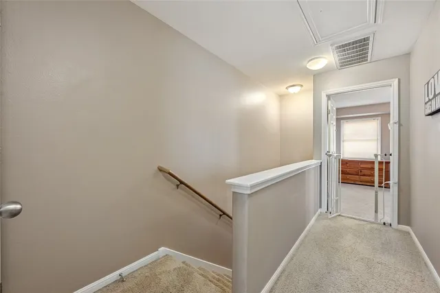 a spacious bedroom with a bed and a window