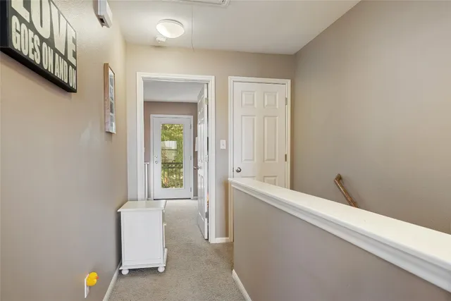 a bedroom with furniture and flat screen tv